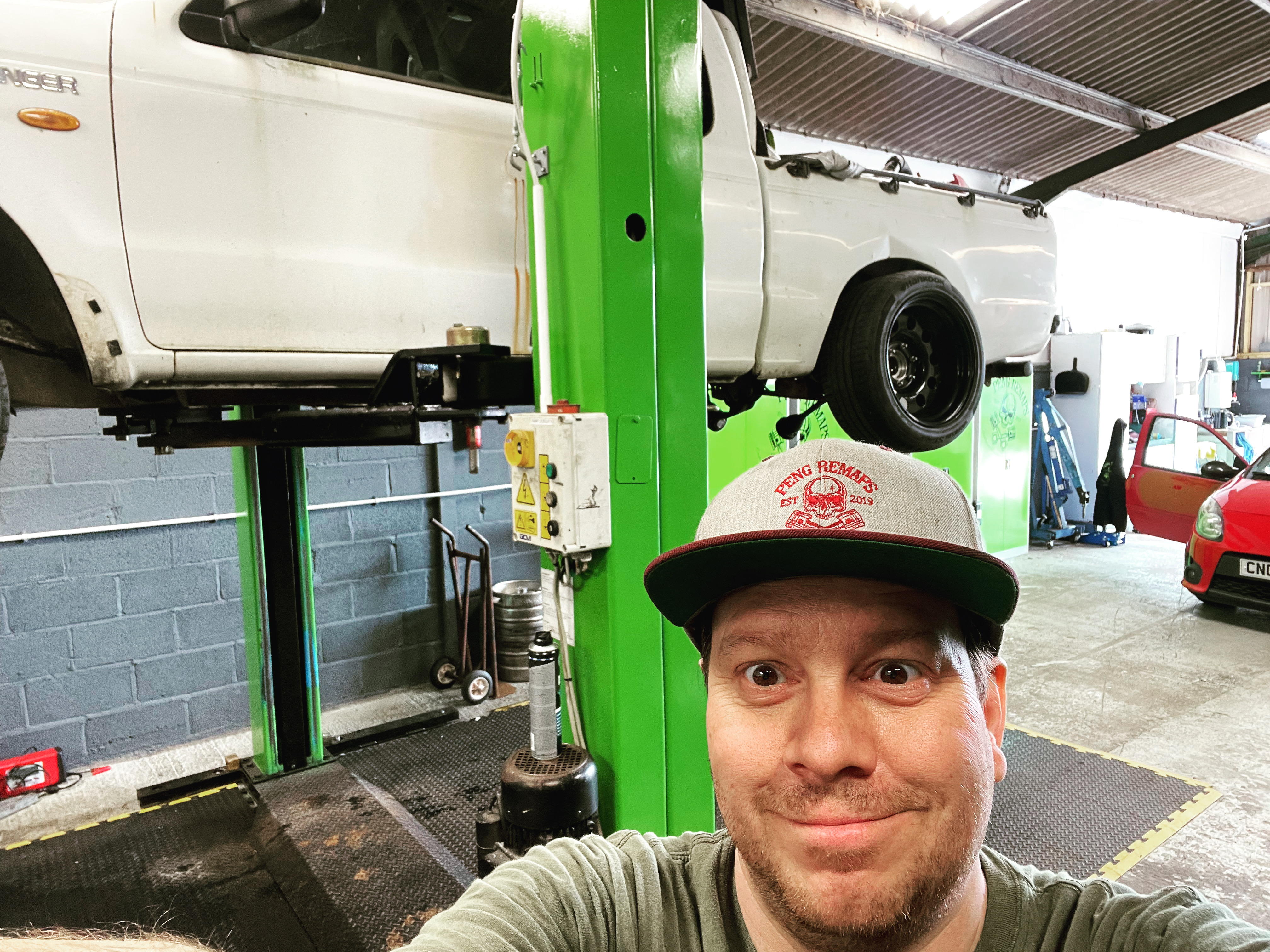 Robin working on a car